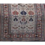 Good quality Persian village carpet with geometric ethnic decoration upon a cream ground, 200 x