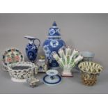 A collection of tin glazed earthenwares including a blue and white vase and cover with floral