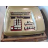 Brunsviga coated steel calculating machine, with original leather case