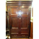 A Georgian oak hanging cupboard, freestanding and enclosed by a pair of three quarter length twin