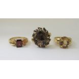 Three 9ct gem set dress rings comprising a garnet, a citrine and a hessonite example, sizes P/Q x