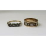 Two diamond set rings; an 18ct three stone example and a 9ct example with heart and beaded detail,