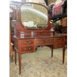 A good quality inlaid Edwardian mahogany knee hole dressing table with satinwood cross-banding and