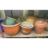 A quantity of mainly contemporary but weathered garden planters including glazed examples, three