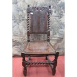 A Carolean side chair in walnut with carved and pierced cresting rail with crown centre, with spiral