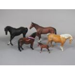 A collection of Beswick horses comprising a Dartmoor show pony, 'Another Bunch', a matt glazed brown