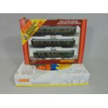 2 boxed sets of Hornby coaches: R2578 BR class 101 3 car pack and R687 BR 3 car diesel pack which