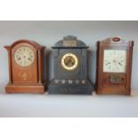 Three various mantle clocks to include a tall wooden mantle clock by HAC of Germany in oak with