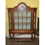 A small 19th century Dutch floral marquetry display cabinet on stand, with figured walnut veneers