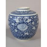An oriental blue and white vase of bulbous form, with all over chrysanthemum scrolling and leaf