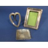 Two silver easel frames, one in the form of a heart, together with a further Edwardian silver pin