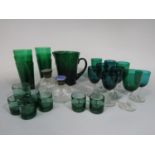 A collection of various green glasses to include goblets and a lemonade set, together with two