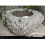 An old, possibly ancient, carved stone mortar with lug handles, 28 cm in diameter (excluding