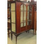 An inlaid Edwardian mahogany side/display cabinet, with tied ribbon, trailing harebell, cross-