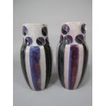 A pair of unusual Royal Doulton vases with art nouveau style black and mottled purple decoration