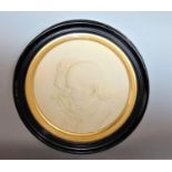 Relief moulded plaque of husband and wife within a gilt and ebonised tondo frame, 38cm diameter