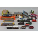 Mixed unsorted collection of unboxed 00 gauge locomotives, rolling stock and model buildings by