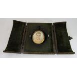 Early 19th century British school - Bust length miniature portrait of a brown eyed baby wearing a