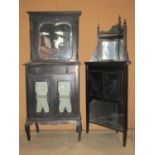 A late Victorian ebonised freestanding corner cabinet partially enclosed by a pair of panelled doors