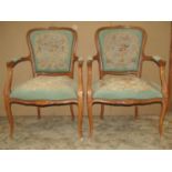 A pair of late 19th century futiles/salon chairs, with floral tapestry upholstered seats and