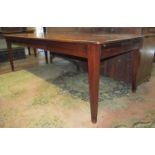 A good quality French provincial cherry wood dining table with plank top, raised on four square