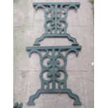 Three pairs of matching cast iron bench or chair ends with scroll detail and green painted finish,