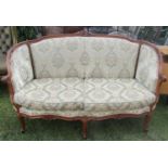 A French parlour room sofa with well carved and moulded show wood frame, raised on cabriole