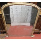 Mid-19th century arched and gilded overmantel mirror with moulded framework and original mirror