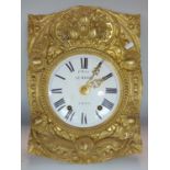 Le Masle, A Gourin, twin train comtoise clock with typical embossed brass case work, 43cm high,