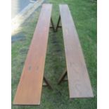 A pair of oak forms or benches, raised on square cut, splayed supports, 2m long, 47cm high