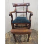A regency mahogany child's high chair on detachable stand, with scrolled arms, upholstered seat