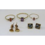 Collection of 9ct gem set jewellery comprising three rings to include a pear cut pink topaz