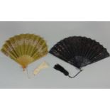 2 early 20th Century French fans, the first with olive silk leaf cut away to reveal fine gauze,