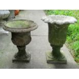 A weathered composition stone fluted garden urn with square cut base, 53 cm high x 42 cm diameter