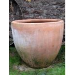 A large contemporary terracotta planter of circular tapered form with oval impressed stamp hand made