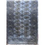 Full pile Bokhara rug with geometric repeating medallion decoration upon a light blue ground, 160