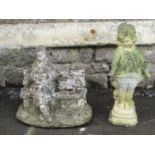 Two weathered reconstituted figures showing a character seated upon a bench and a further example of