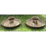 A pair of heavy cast iron Mexican hat style pig feeding troughs with hooped rod divisions approx 3ft
