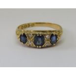 18ct sapphire and diamond gypsy ring, size O/P, 3.8g