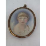Early 20th century British school - Bust length miniature portrait of a blue eyed fair haired child