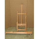 Two small contemporary beechwood portable artists easel of varying design with adjustable framework