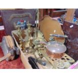 A box of interesting, mainly metal ware items to include various brass candlesticks and trivets,
