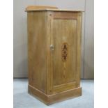 In the manner of Charles Bevan - A Victorian ash wood bedside cupboard, enclosed by a rectangular