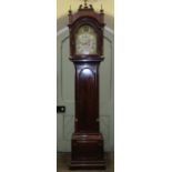 A good George III mahogany longcase clock, the trunk with arched and panelled door enclosing a