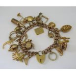 Good 9ct curb link charm bracelet with heart padlock clasp, hung with twenty four novelty charms,