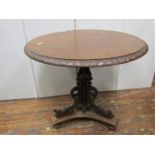A mid Victorian period oak occasional table, the circular top 65cm diameter, raised on a tri-corn