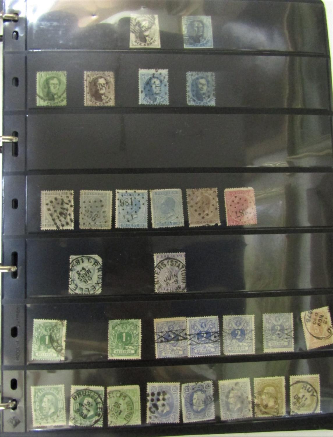 An album containing a collection of Mint and Used stamps from Belgium from early issues and