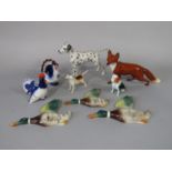 A Beswick model of a running fox, a Beswick hound, a Beswick Dalmatian marked Arnoldene, a pair of