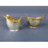 Early 20th century regency style milk jug and sucrier, engraved with floral swags, maker ME FE,