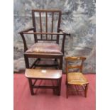 A regency mahogany child's high chair with reeded back and hide upholstered seat, with a